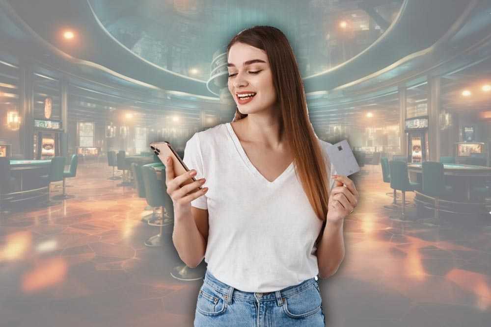 Дівчина в казино, яка використовує свій мобільний телефон для поповнення рахунку через мобільний